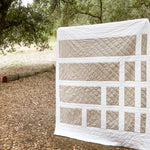 Load image into Gallery viewer, Photo of a two-color Box Canyon quilt, a modern minimal quilt design
