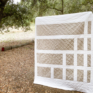 Photo of a two-color Box Canyon quilt, a modern minimal quilt design